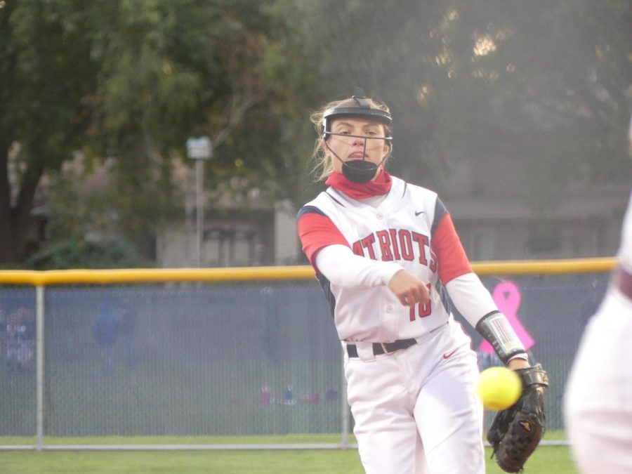 Senior Jackie Morrissey pitches in the Swing for the Cure game against Papillion La-Vista. Photo by Lydia Bruckner.