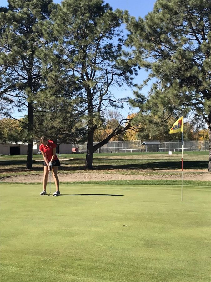 Ella Haakinson putts on the 18th holf of the State Golf course in Norfolk. Photo by Coach Geary.