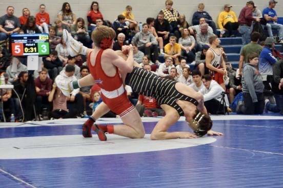 Senior Scott Robertson takes down his opponent. Photo courtesy of Scott Robertson.