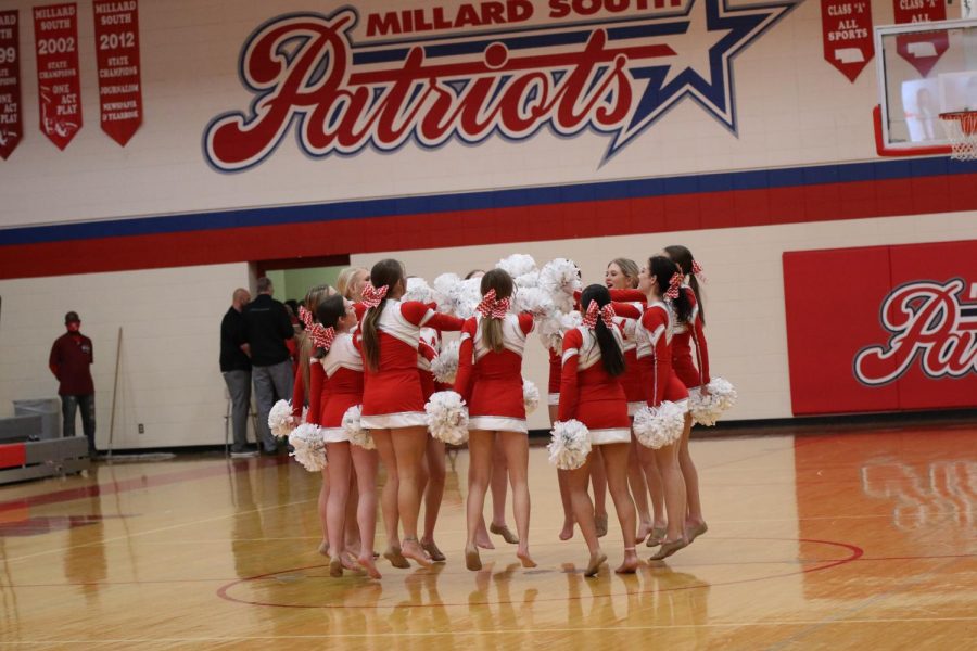 Senior Haley Gosch and her team chant before for their halftime performance in the Girls Varsity Basketball game against Norfolk. Photo by Hannah Doornink.