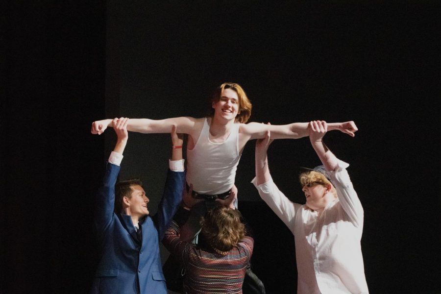 Fellow contestants Connor Scmidt, Austin Meyer, and Bradyn Bode lift Torin Edwards into the air during the opening dance number, recreating an iconic Dirty Dancing scene.
-Photo by Ally Seevers