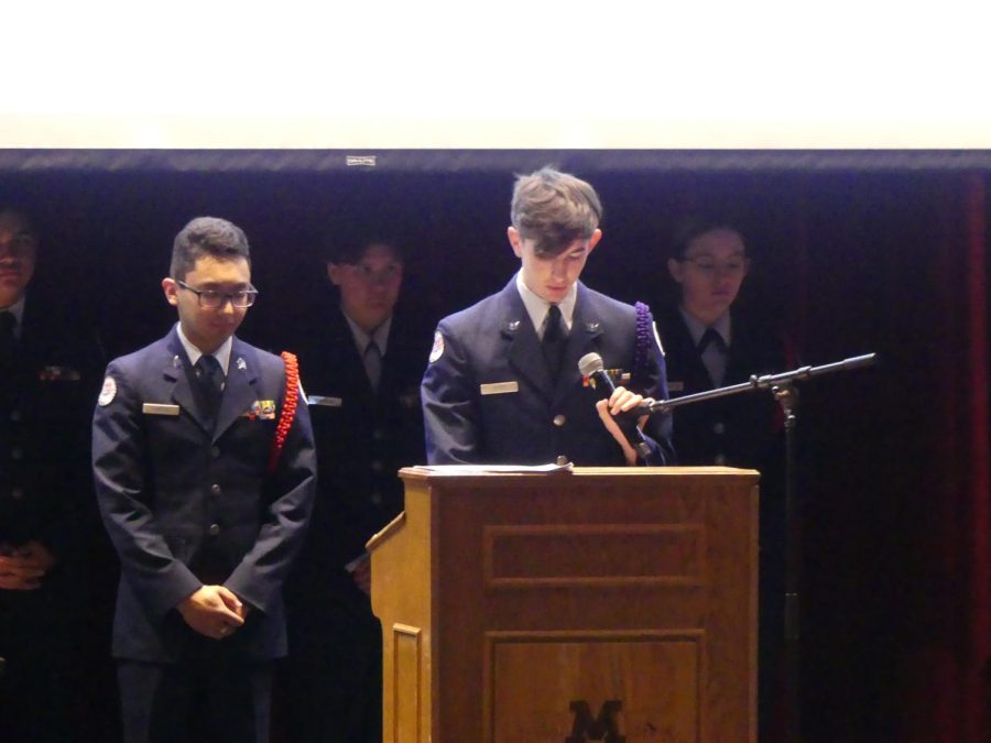 Junior Kaden Larkin guides the cadets and audience through the Chaplains prayer
-Photo by Darian Pierre