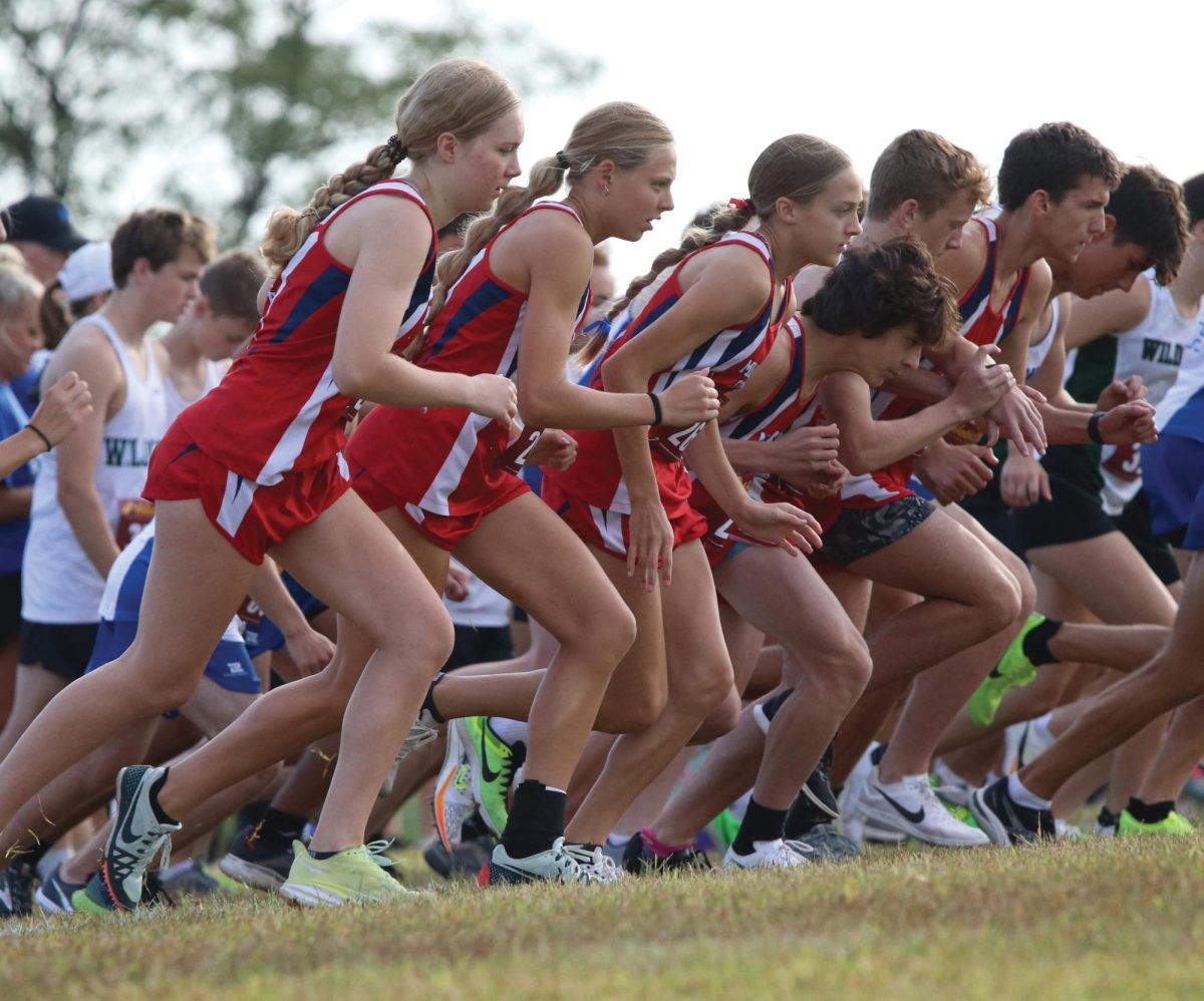 The sophomores of the cross country team take off side by side at the Class of the Metro Meet.