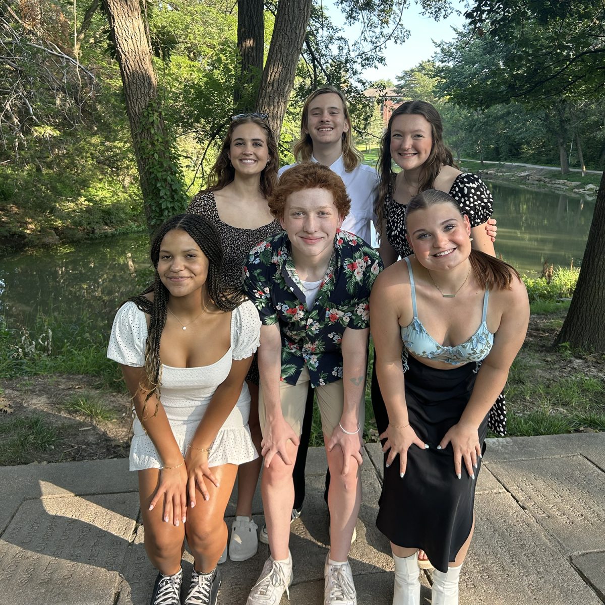 Freshman Ava Nkwocha, Junior Ben Dickson, and Seniors Avery Hlivko, Kaia Kohles, Robert Baker III, and Josephine McPhaull pose for a picture at the Launch banquet at July Workshop 2023.
