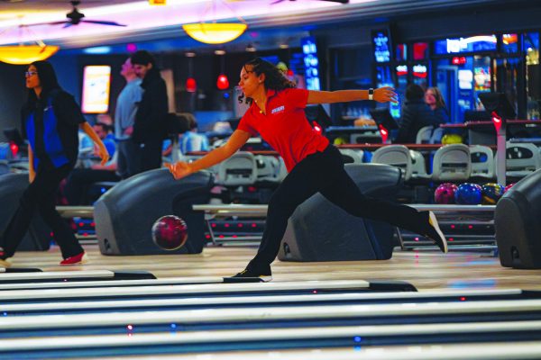 Senior Rylee Anderson tosses ball down the lane in dual against Omaha Westview at Maplewood Lanes.