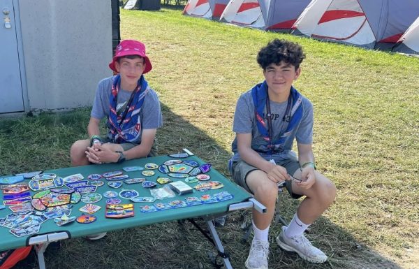 Jamison and his friend Isaac trade patches at the National Scout Jamboree.