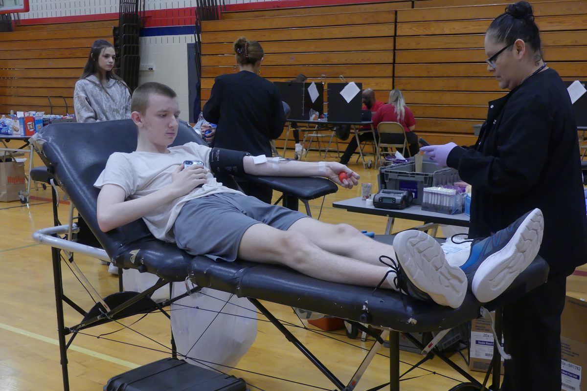 Senior+Matthew+Kelding+prepares+to+donate+blood.