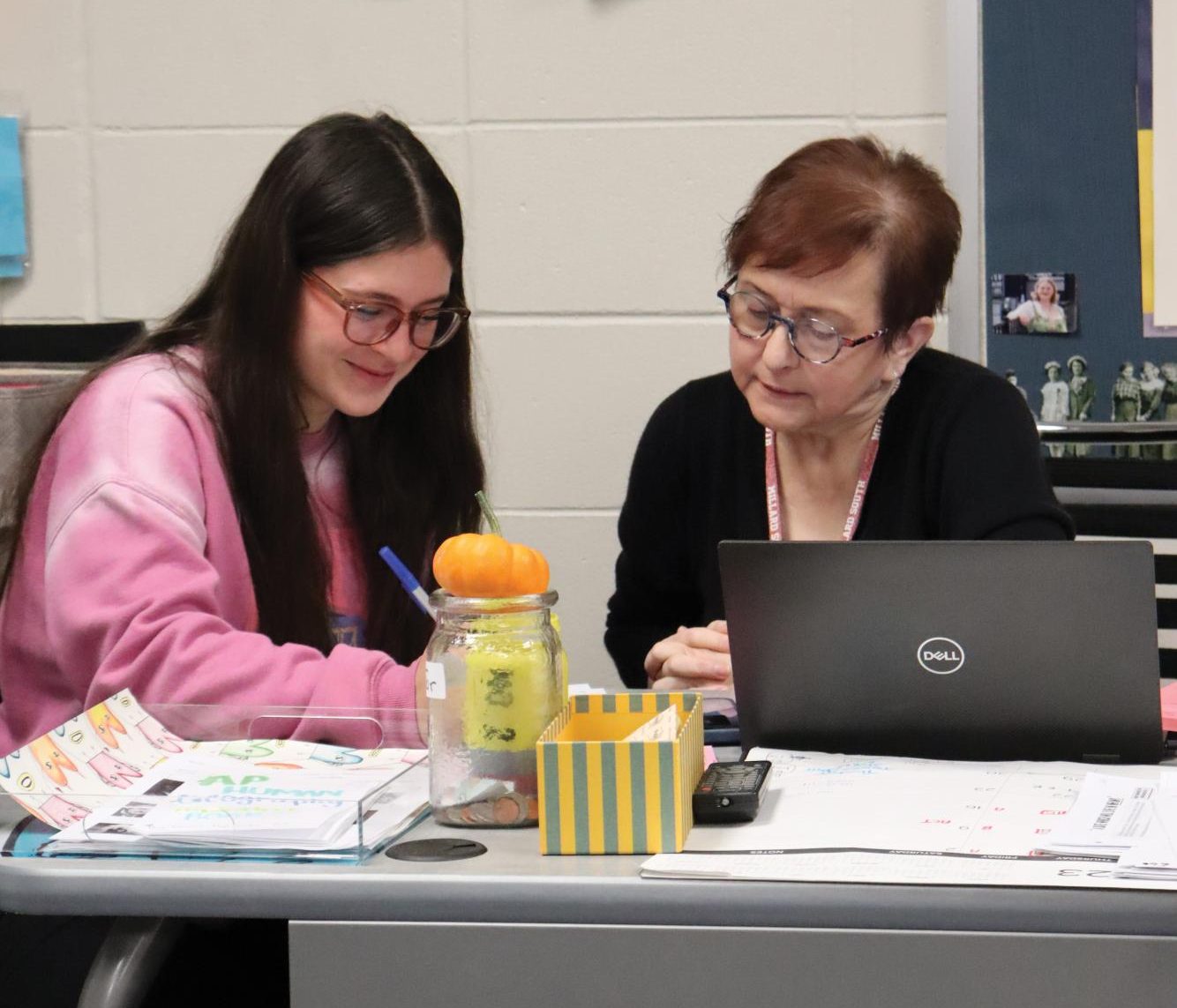 Junior Zia Willits works with social studies teacher Lula McCaskill on a U.S. History exam. 