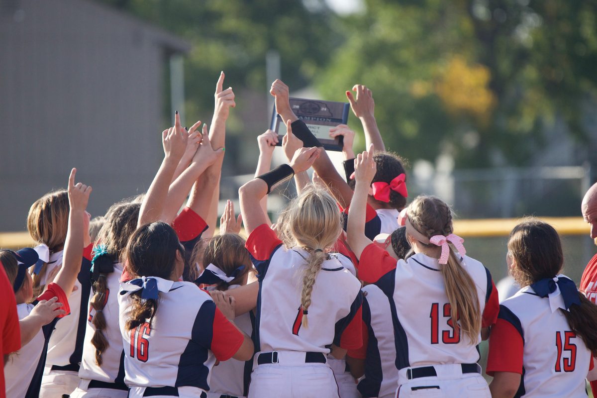 The Millard South girls softball team celebrates their district championship, coming back to defeat Q-Street rivals, Millard West, 10 to 8. 