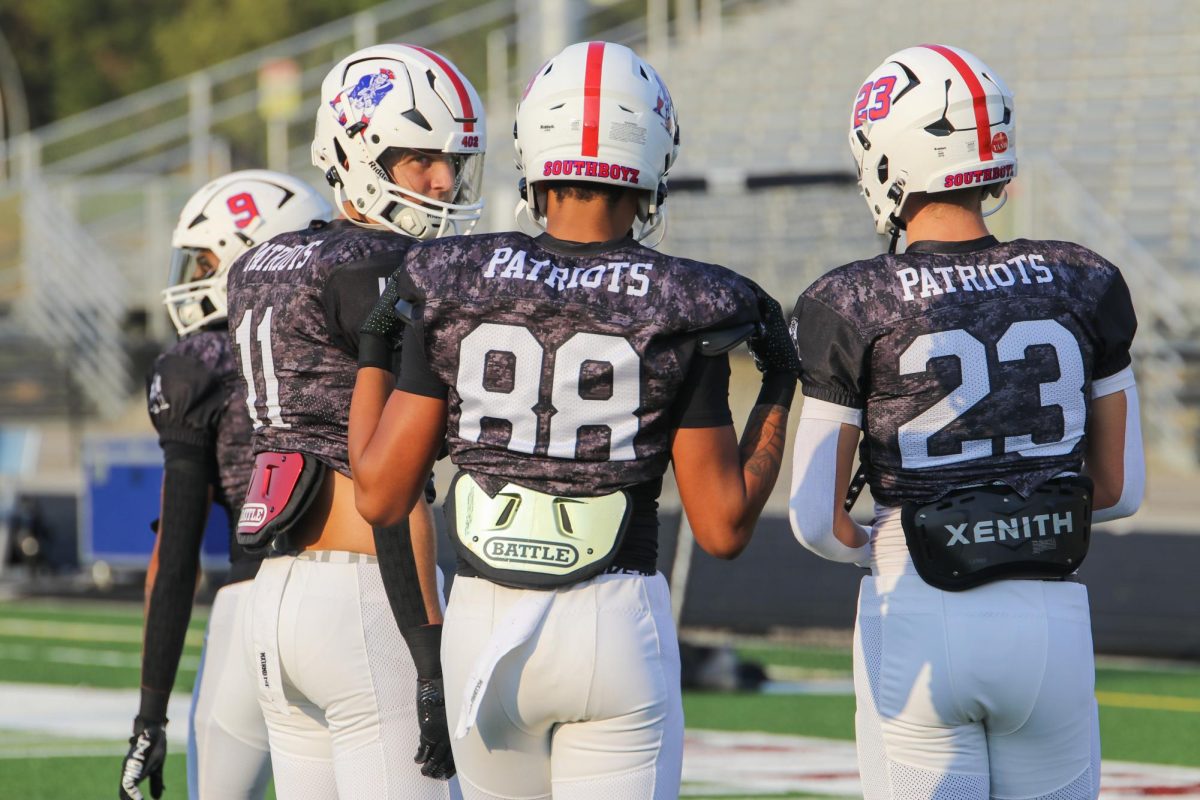 Dallas Gaius-Anyaegbu, Chase Loftin, and Isaac Jensen talk during the pregame.