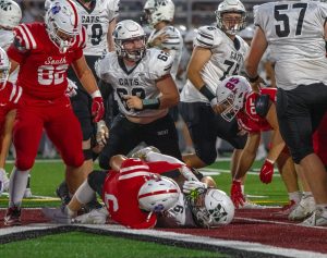 Dylan Kuhl makes the tackle against number 6 on Millard West