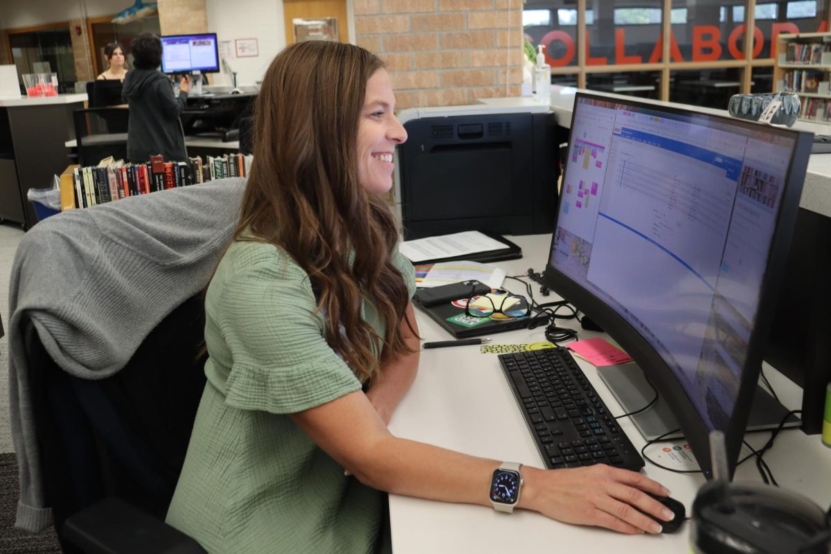 Librarian Jen Prasch is back at her home office after spending the summer at Millard West being an administrator for summer school