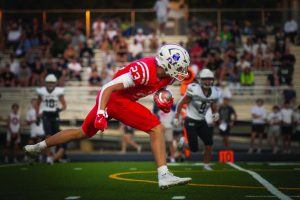 Chase Loftin runs into the endzone after Jett Thomalla throws him the pass, securing the 56-0 win over Millard West.