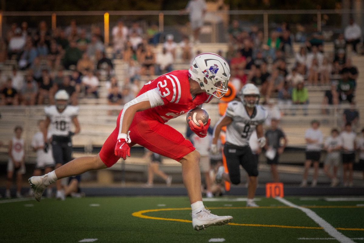 Chase Loftin runs into the endzone after Jett Thomalla throws him the pass, 
securing the 56-0 win over Millard West.