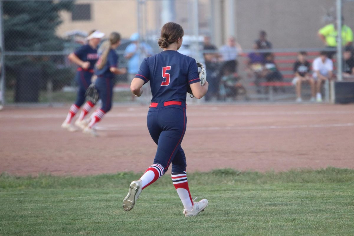 Bianca Calabretto running back to the dugout after her team won the game