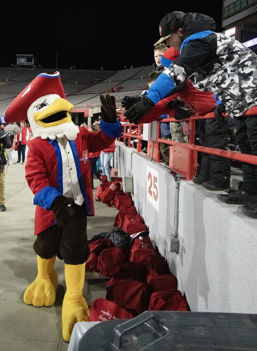 Patriot Pats greets some young members of the crowd.