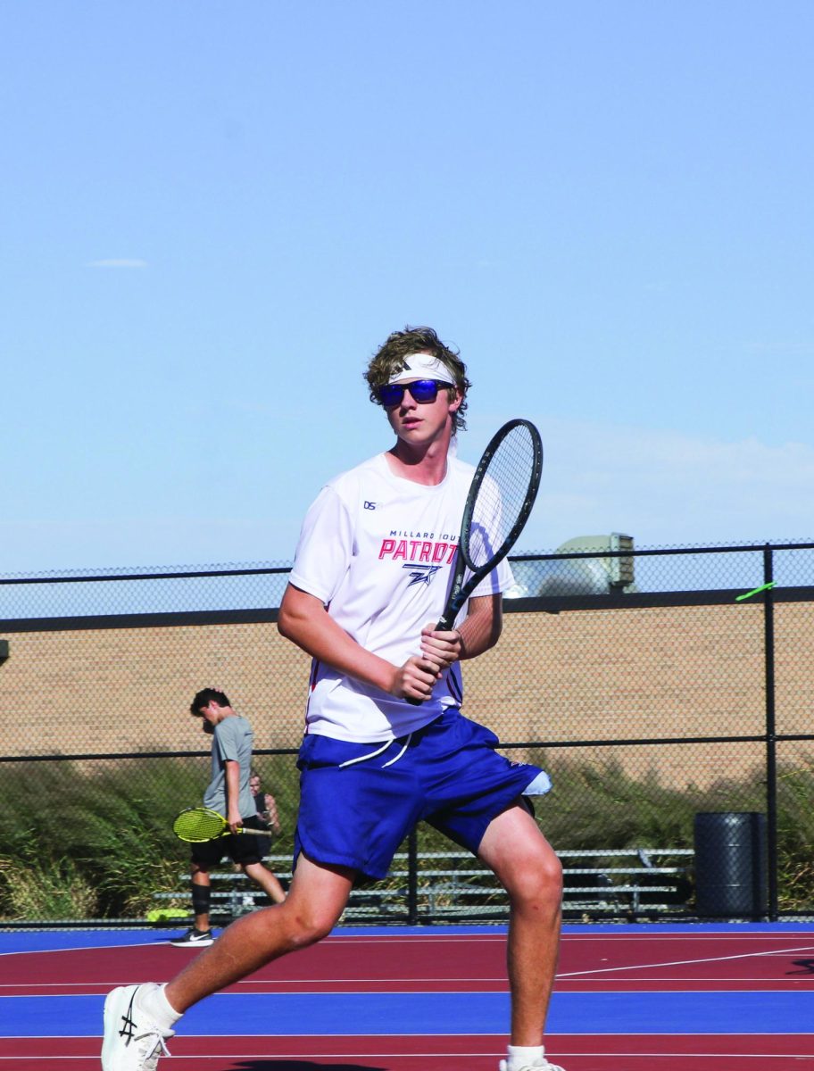 Caleb Schmidt runs to intercept ball coming from the other side of the court. 