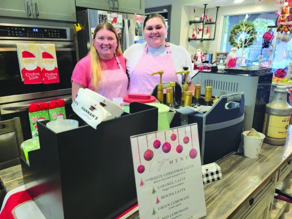 Hannah Fraiser and Amanda Newburn serve coffee at a client’s Christmas-themed baby shower. Photo courtesy of Hannah Fraiser. 