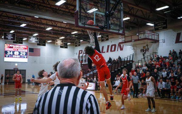 Junior Jett Thomalla goes up for the dunk.