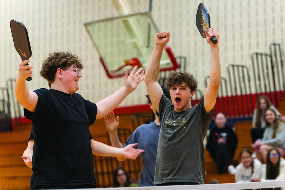 Juniors Tony Chonis and Hayden Poston exclaim victory after the play that won them the NHS pickleball championship.