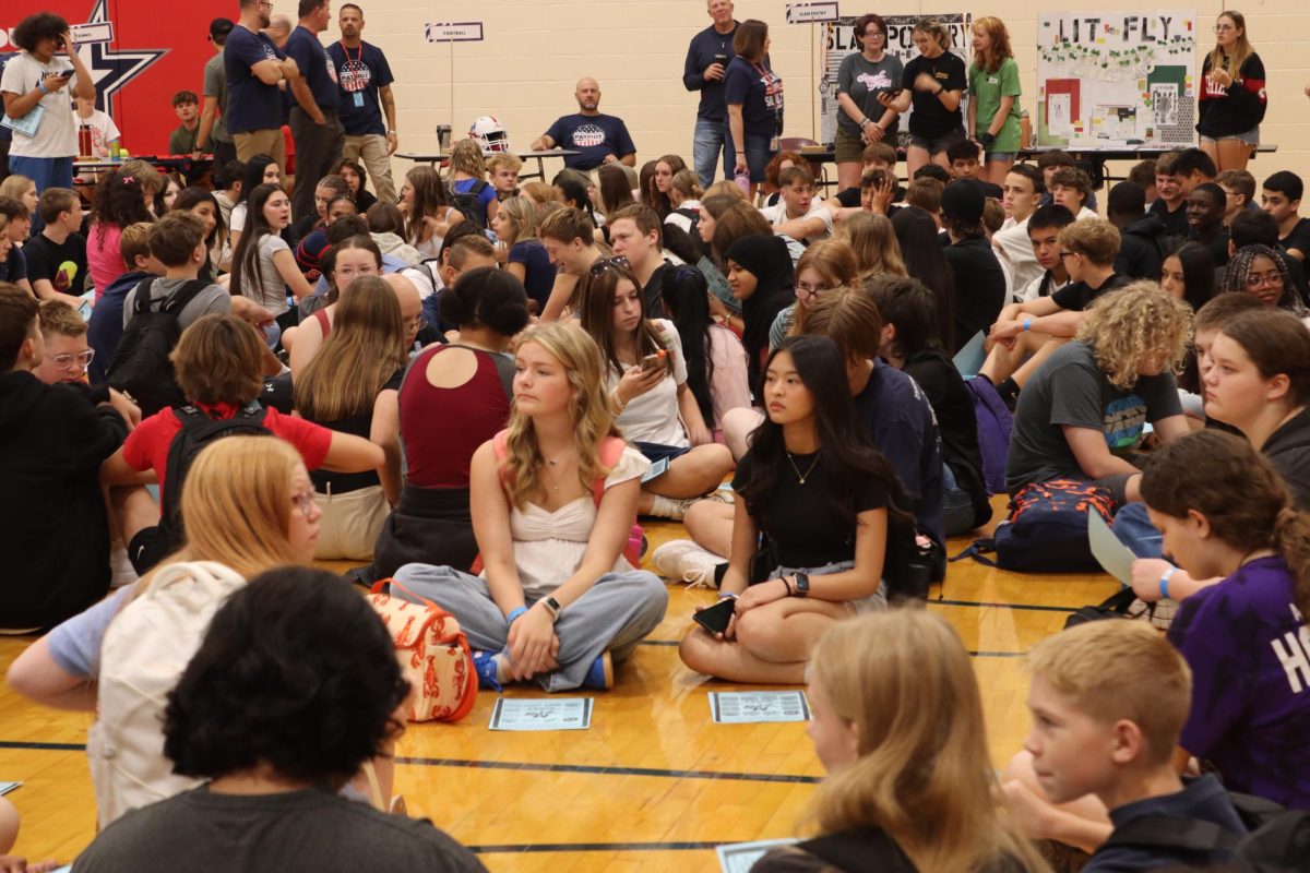 Freshmen wait for instructions with their Activity Bingo Card.