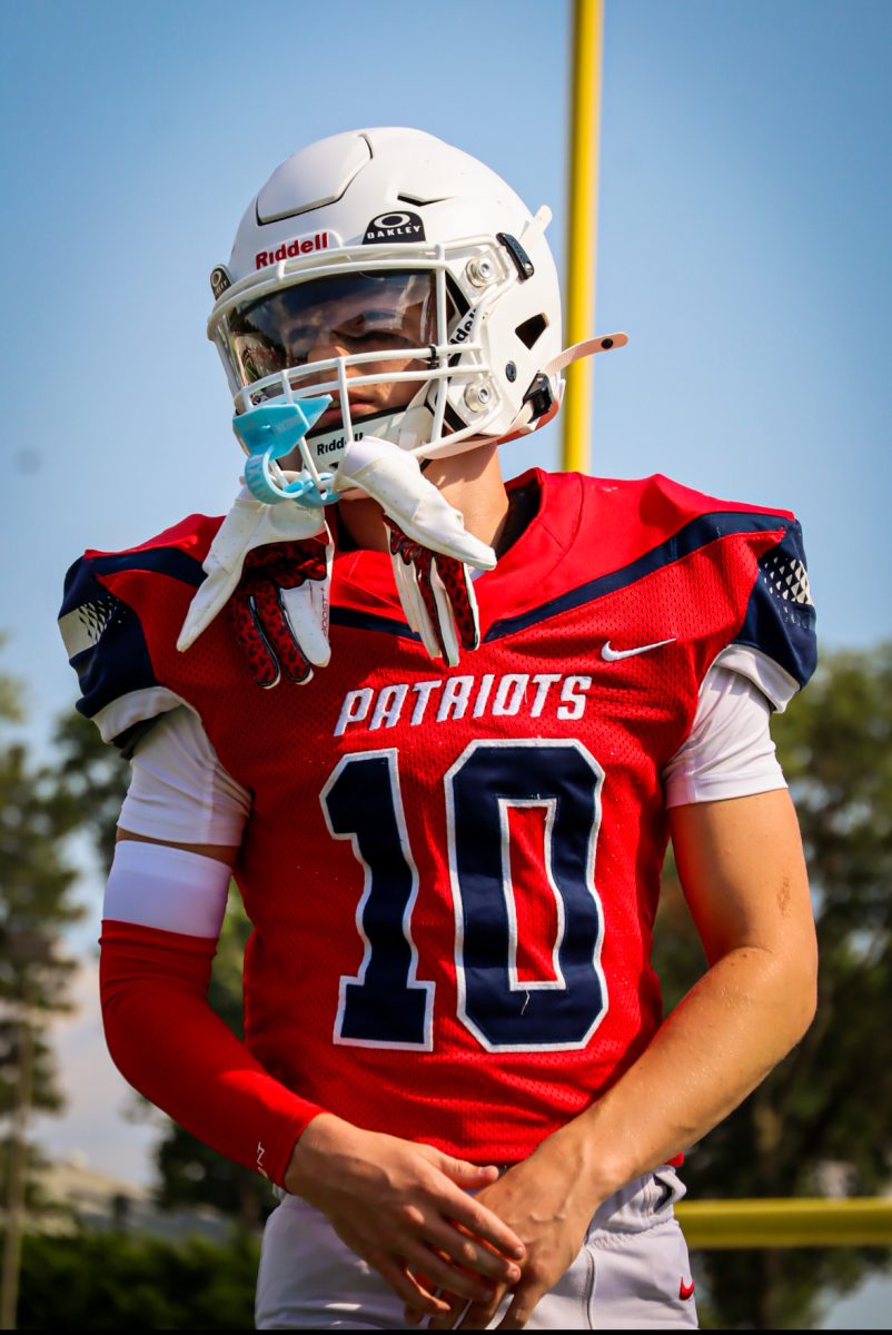 Wide Receiver Riley Rickard gets ready at pre game for the big game.