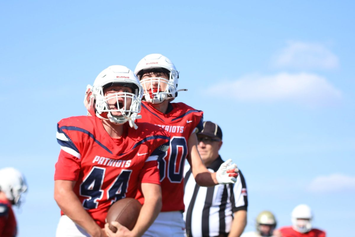 Elliott and Tyler celebrates after a touchdown.