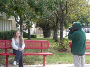Freshman Merin Brandt takes a portrait of classmate freshman Amaya Sunde in Mrs. Kaldahl's Intro to Journalism Class. Students were practicing taking portraits in natural lighting.
