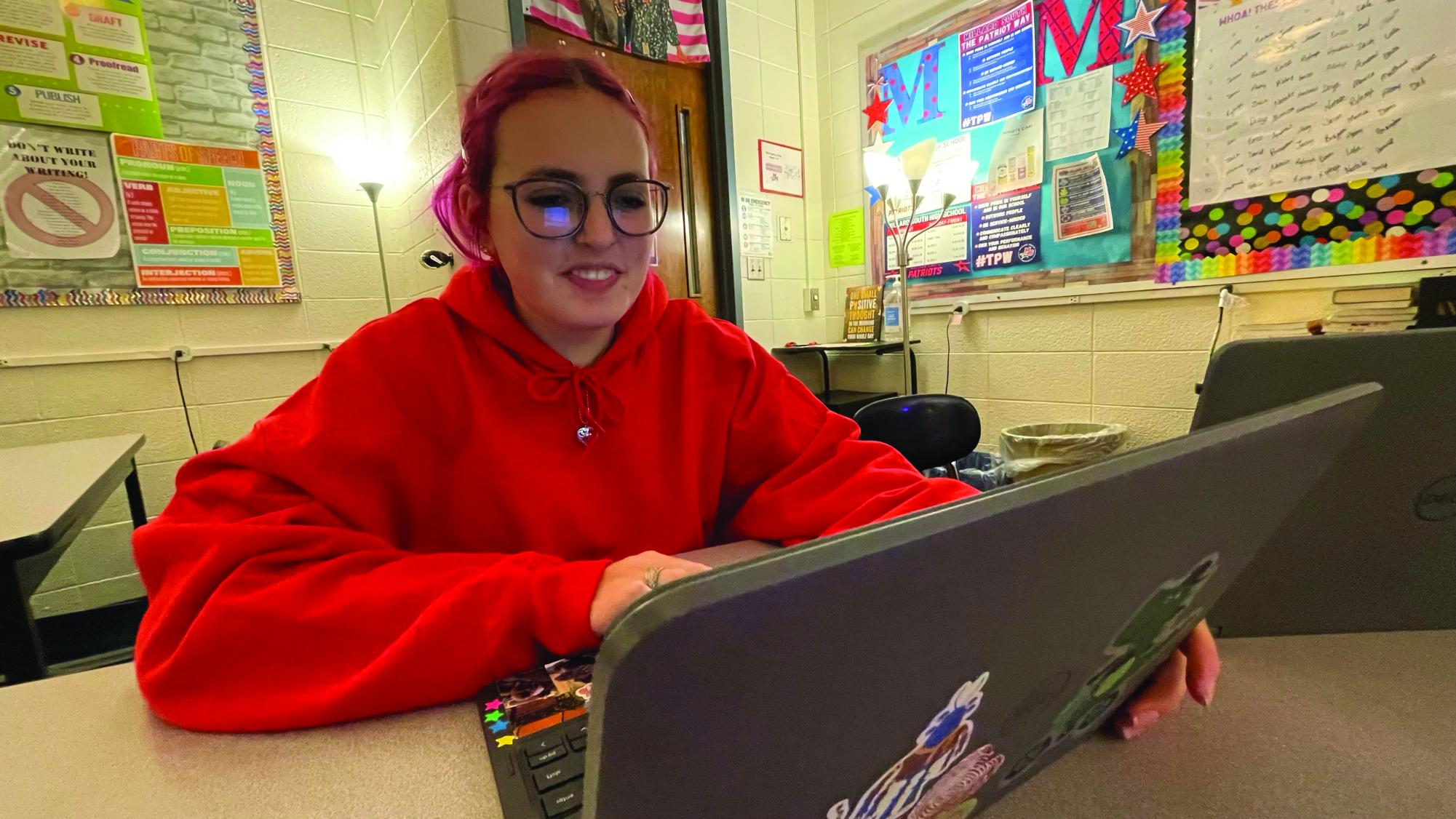 Sophomore Cecilia Elgert sits at her laptop working on the Magazine. Elgert is editor-in-chief of Litfly this year and is primarily in charge of layout and design. They use the software Kittl in order to create their layouts. 