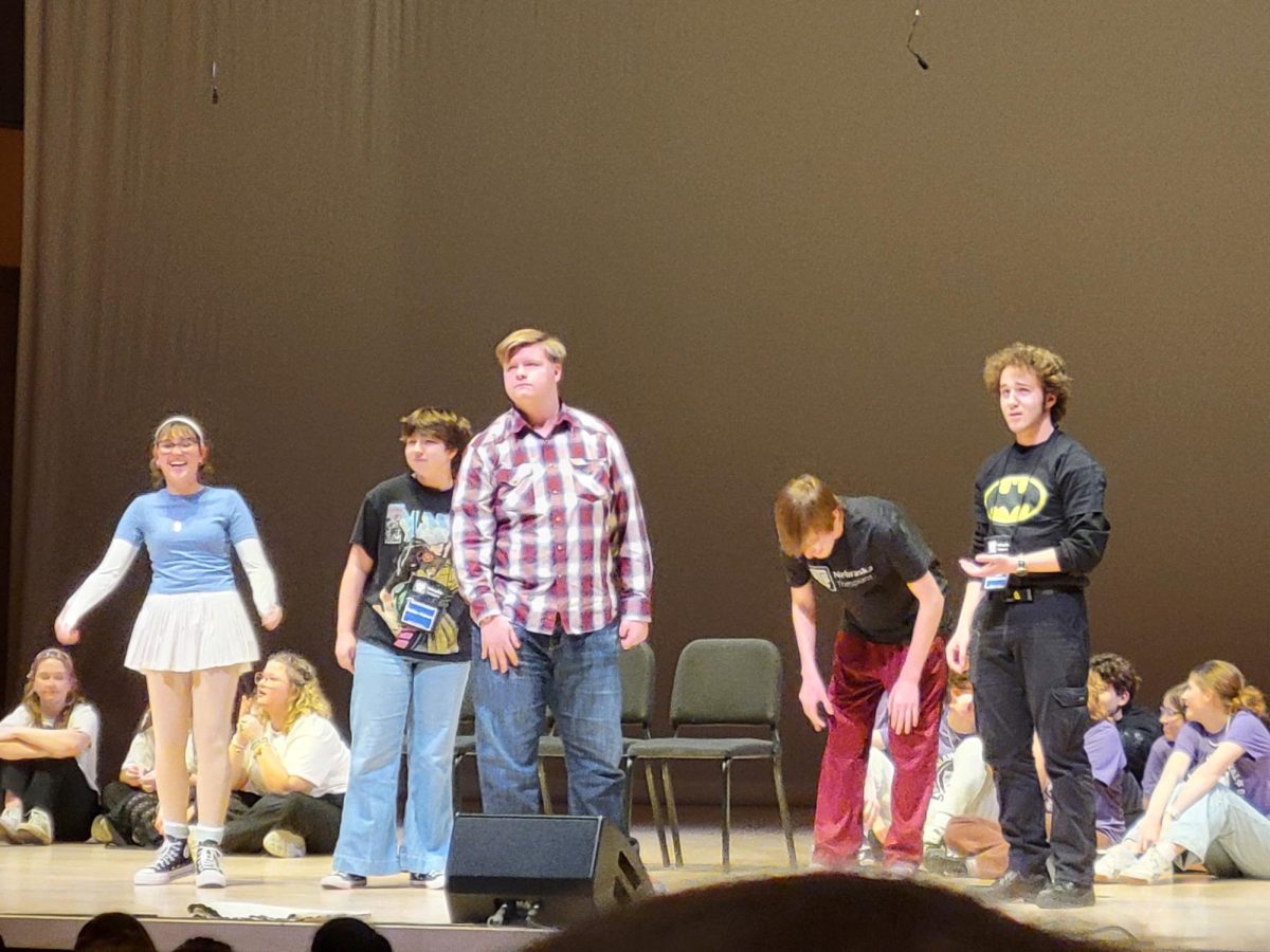 Impov team members, Halle Hinton, Maria Hubert, Rosey Wilken, Toby Schwietzer, and Ryan McConachie perform a scene at the final Showcase. The top four groups got to perform on stage. 