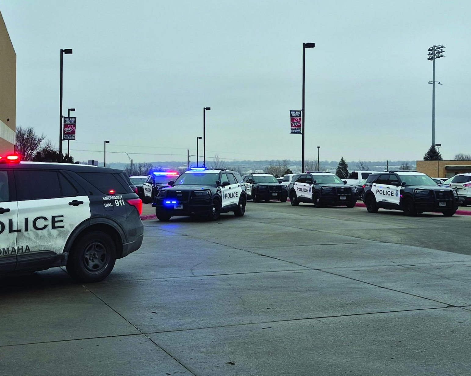 Omaha police department vehicles line the circle in front of Millard South on February 4th responding to swatting call. 


