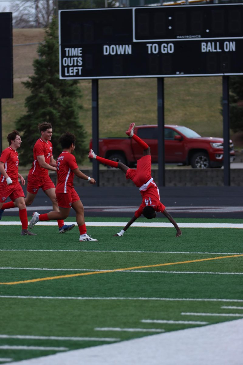 Mohamed Gulukama attempts a cartwheel after he scores against West.