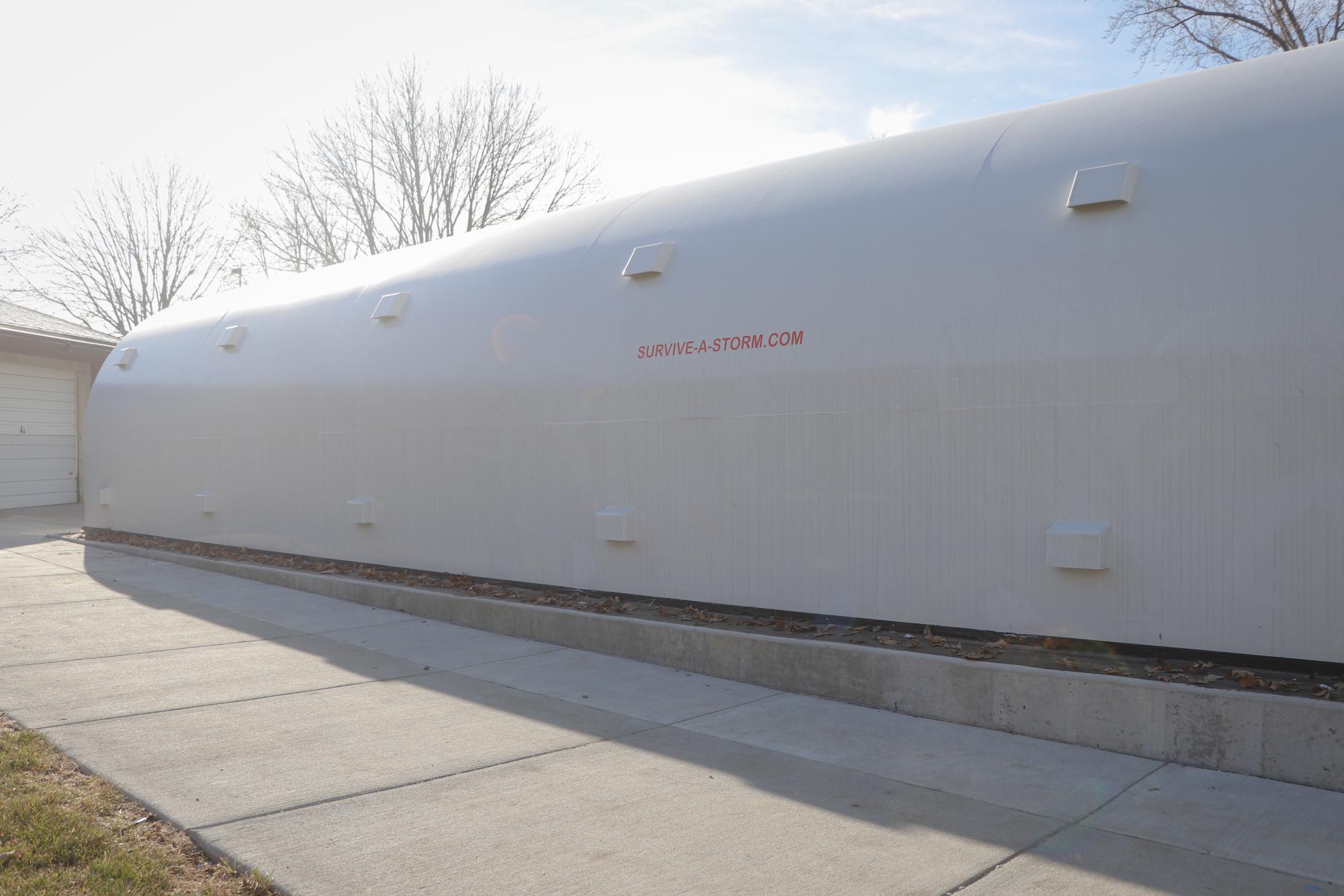 The new storm shelter towers over its surroundings in order to have a higher capacity.