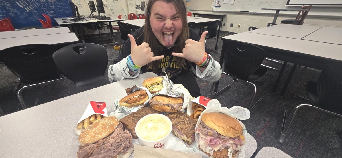 The food (Clockwise from top), deluxe burger, chicken cordon bleu, beef and cheddar, crinkle fries, half pound roast beef, reuben sandwich, white cheddar mac and cheese, curly fries, and the meat mountain.