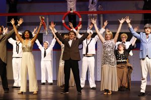 The full company of Anything Goes end the Finale in joy after multiple weddings on the S.S. American.